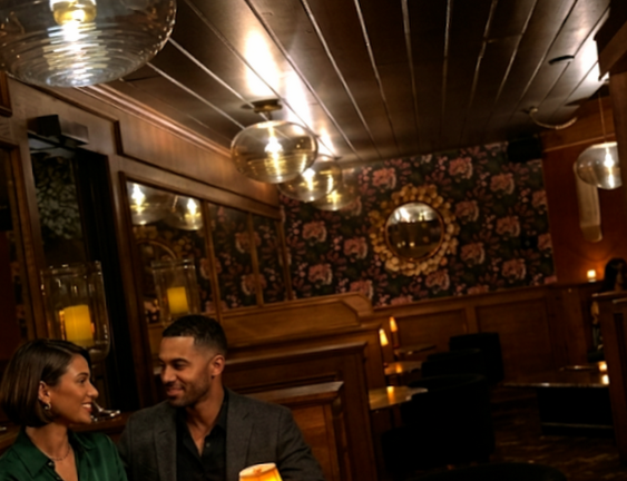 Interior of Del Rey at Villa Royale with dim lighting, wood accents, and intimate seating