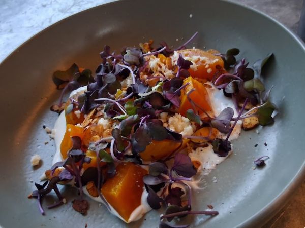 Smoked golden beets plated over crema and queso fresco, topped with microgreens and spiced almonds.