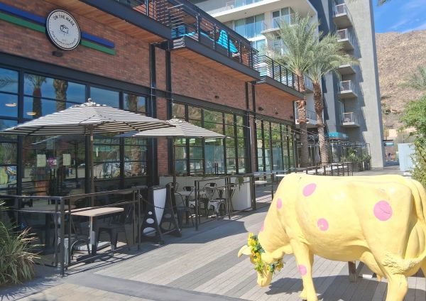 The iconic cow in front of On The Mark's Palm Springs food store
