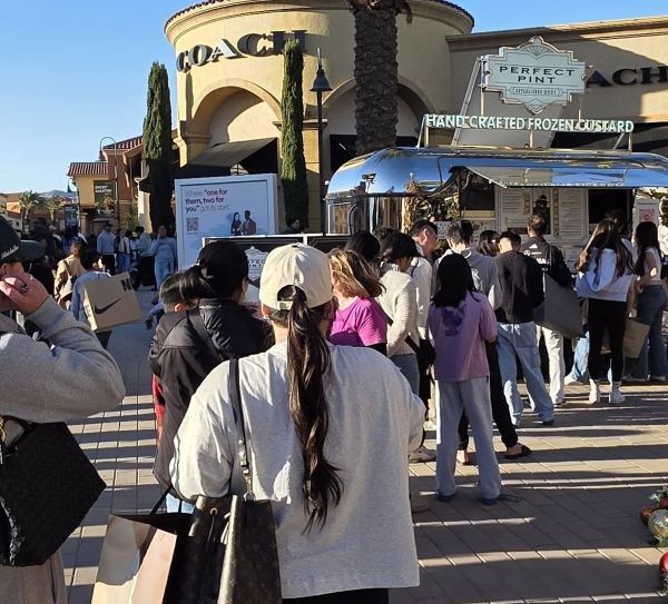 A busy crowd buying Perfect Pint ice cream at the Cabazon Outlets