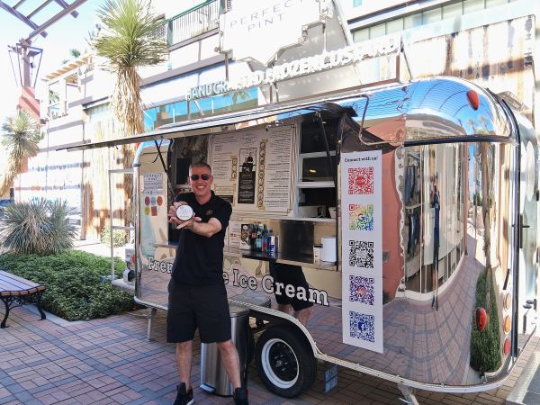 Perfect Pint owner Jordan Panaiotov stands in front of his Palm Desert Airstream, promoting ice cream