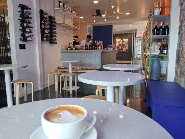 An interior shot of Sottovoce Cafe in Palm Springs with a Latte at the foreground