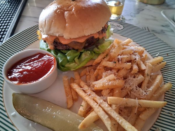 USDA Prime burger with parmesan fries at Colony Club.