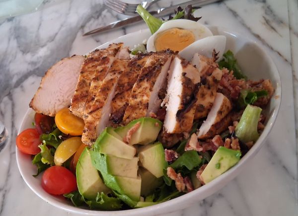 Colony Club’s Cobb salad with grilled chicken, avocado, bacon, and mixed greens.