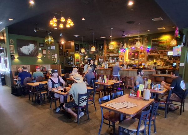 The interior of Tiny Pony in Yucca Valley showing diners at tables and at the bar