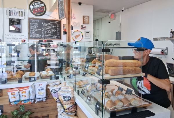 A selection of sandwiches displayed inside the café, highlighting fresh bread, cured meats, and mozzarella.