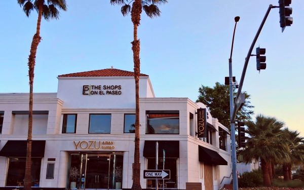 Exterior view of Yozu Asian Bistro located at The Shops on El Paseo in Palm Desert, California, at dusk.