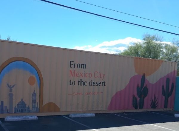 Delicias Storage container behind restaurants that says "From Mexico City to the Desert"