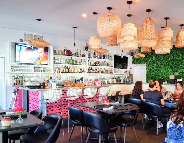 Interior of Bar inside Delicias showing staff behind counter