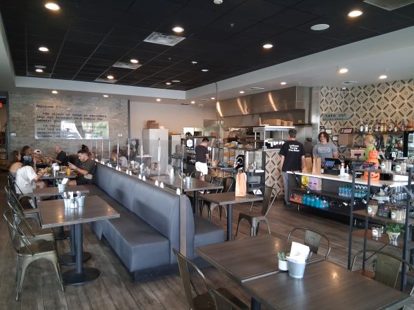 Interior of Heirloom Craft Kitchen in Indio showing modern American diner vibe with open kitchen and counter service